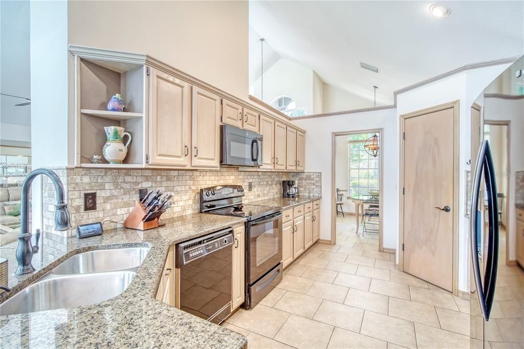 Closet pantry, stainless double sink, granite counters, wonderful working space.