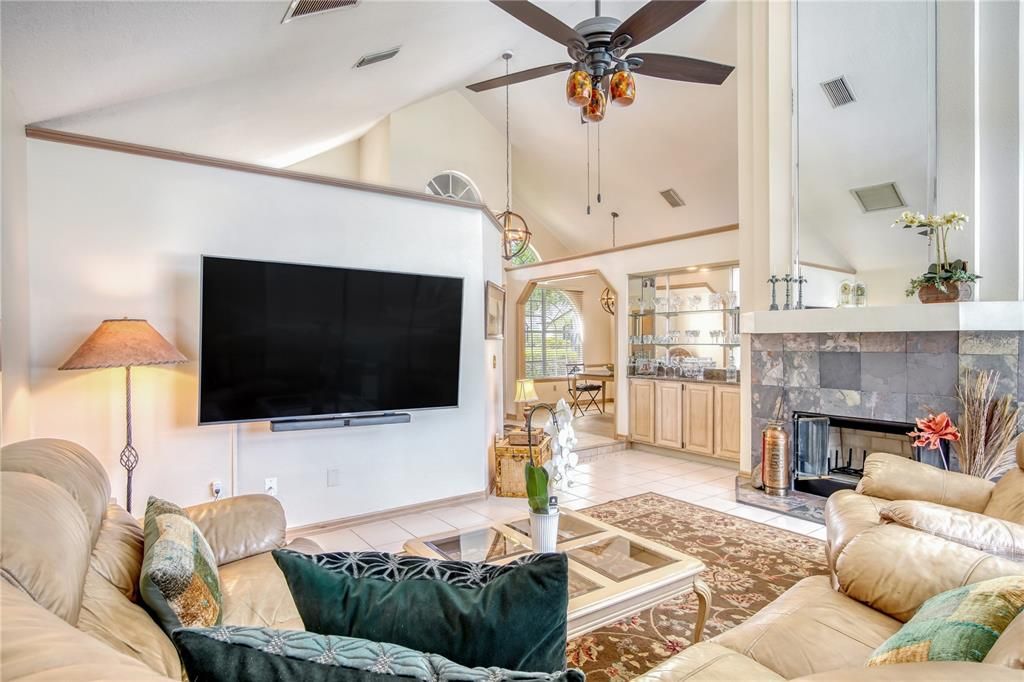 Family room with soaring ceilings and already equipped with large flat screen TV.