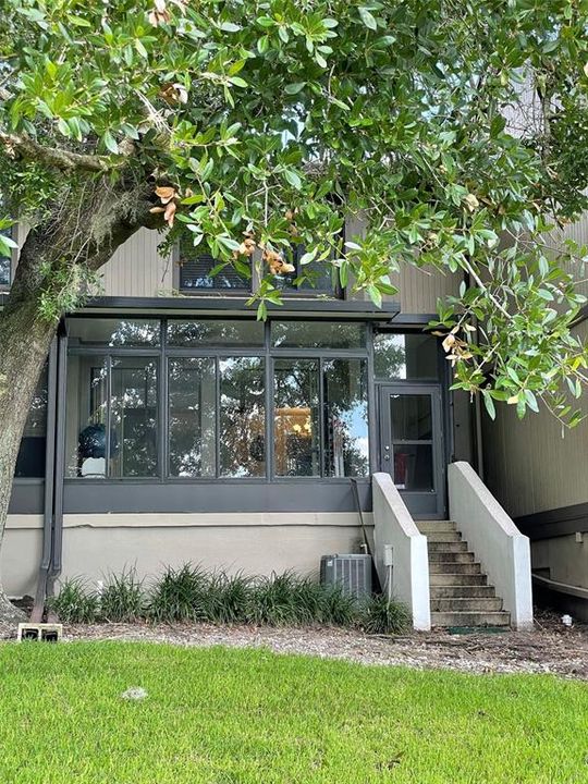 Back of condo showing private stairway to backyard/lake