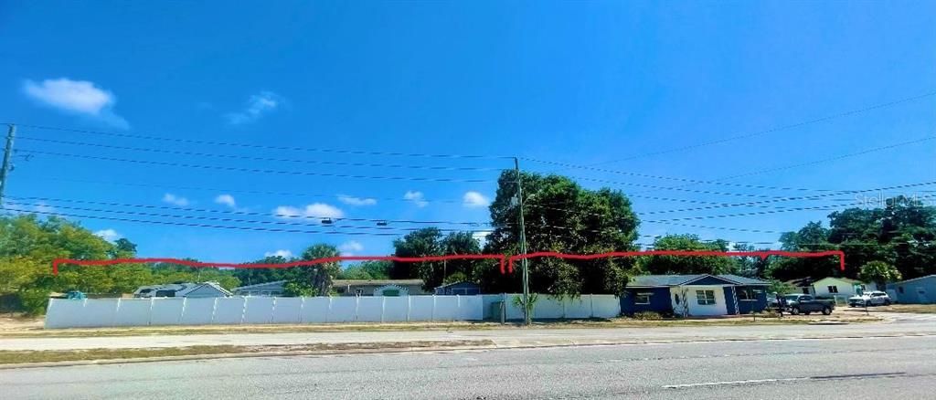 Front View of Vacant Lot (Left) & Home (Right)