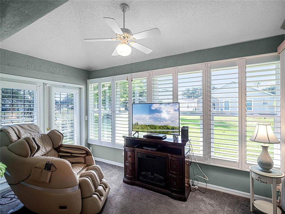 Bonus Rm/Four-Season Sunroom with Plantation SHutters and access door to the rear open patio. This room is zoned with heat & air for year round enjoyment.