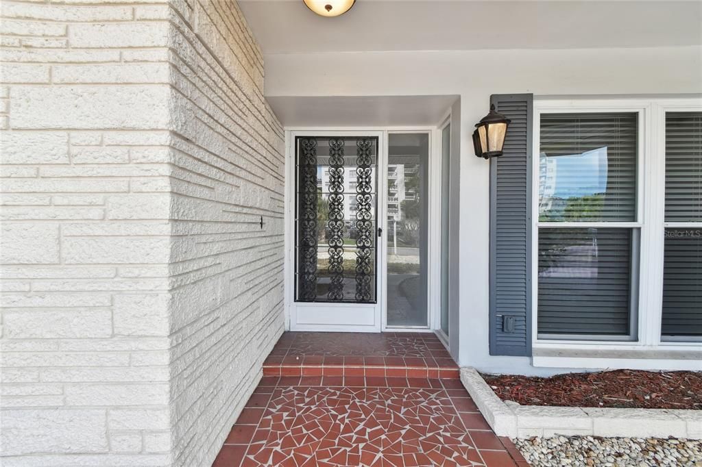 Screened door entrance allows for the east west cross breezes.