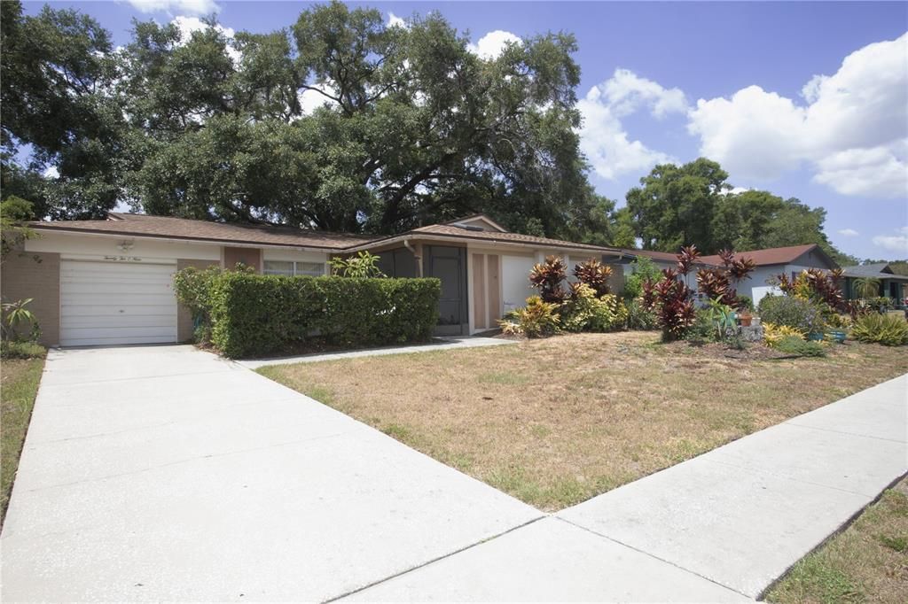 FRONT OF HOUSE WITH GARDEN AREA