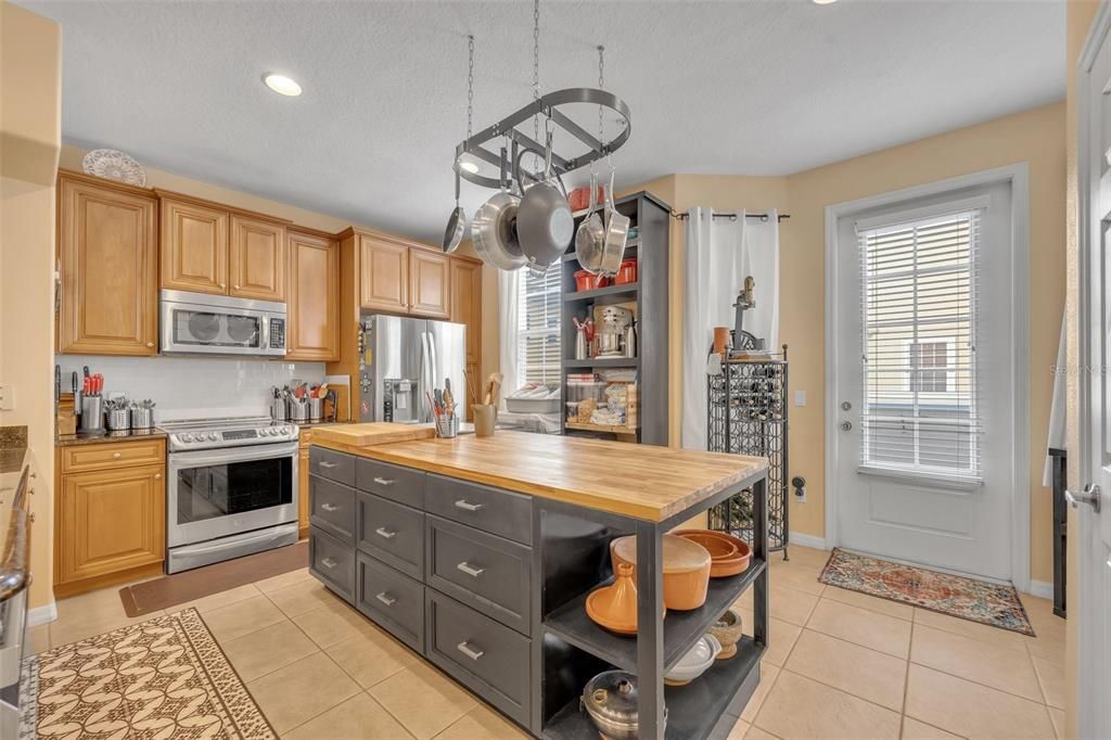 Induction Range/Convection Oven. Door to the balcony is on the right.