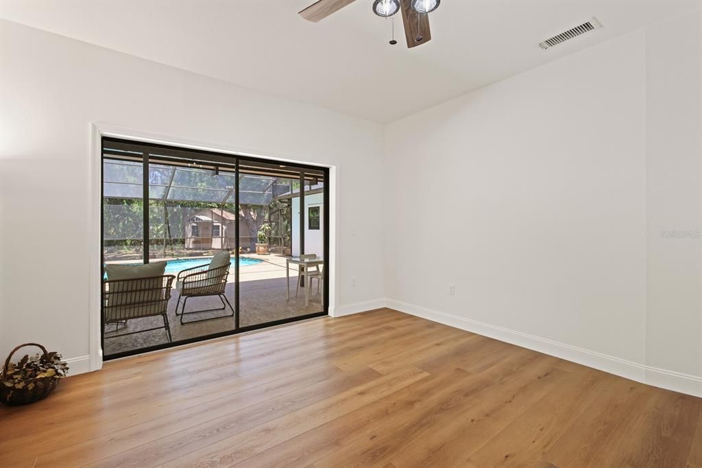 Living room with sliding door to backyard oasis