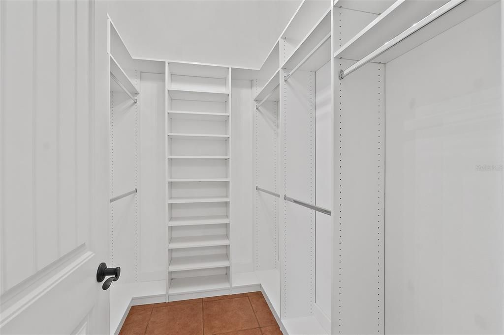 One of Two Master Walk-in Closets w/Custom Built-ins