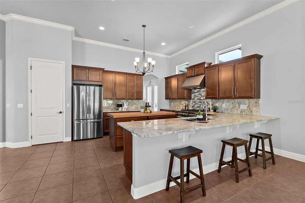 Crown Molding, Tile Floors, and Walk-in Pantry