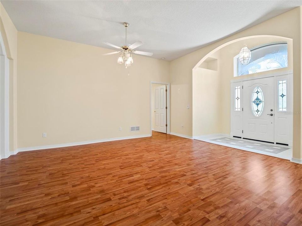 Living Room, entrance to home and entrance to Primary Bedroom