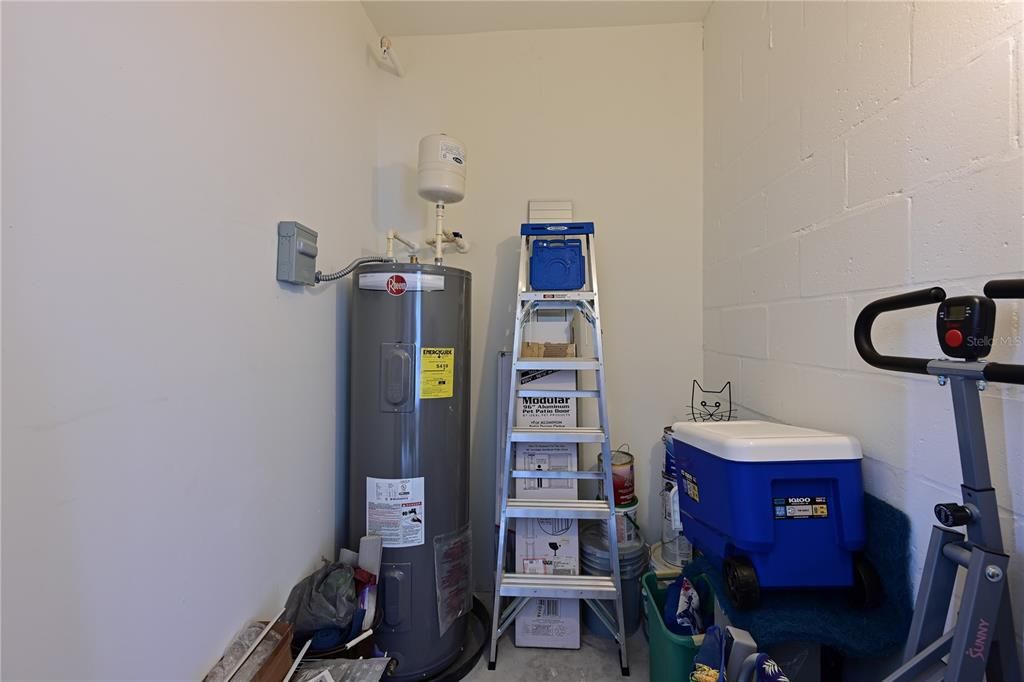 Interior storage with electric and water heater placement.