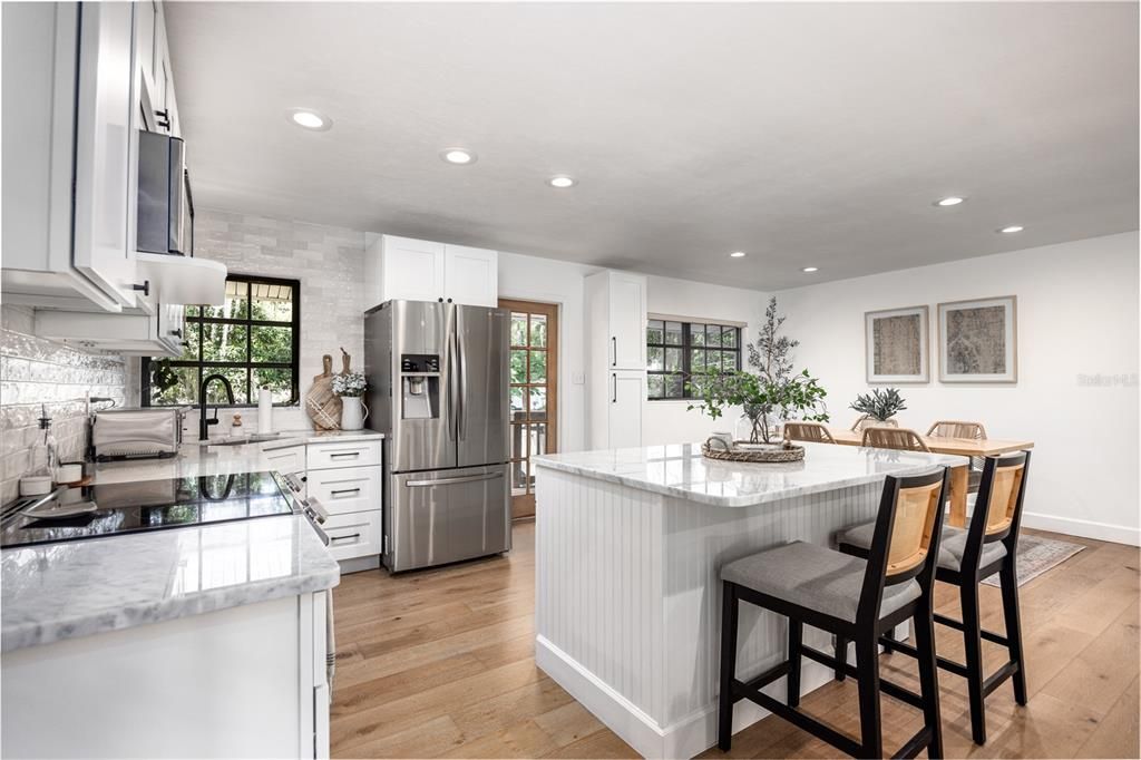 Timeless Marble Countertops and Island with Seating