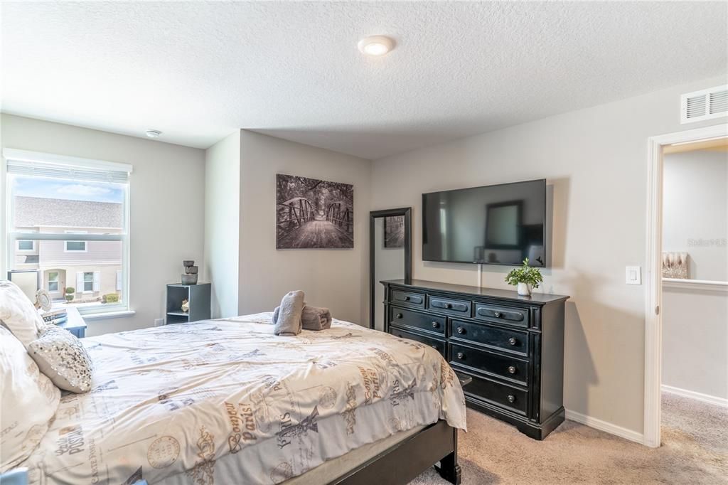 Upper level hallway bathroom features dual vanities