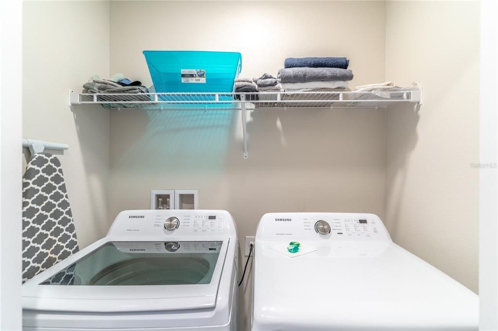 Upper level washer and dryer convey