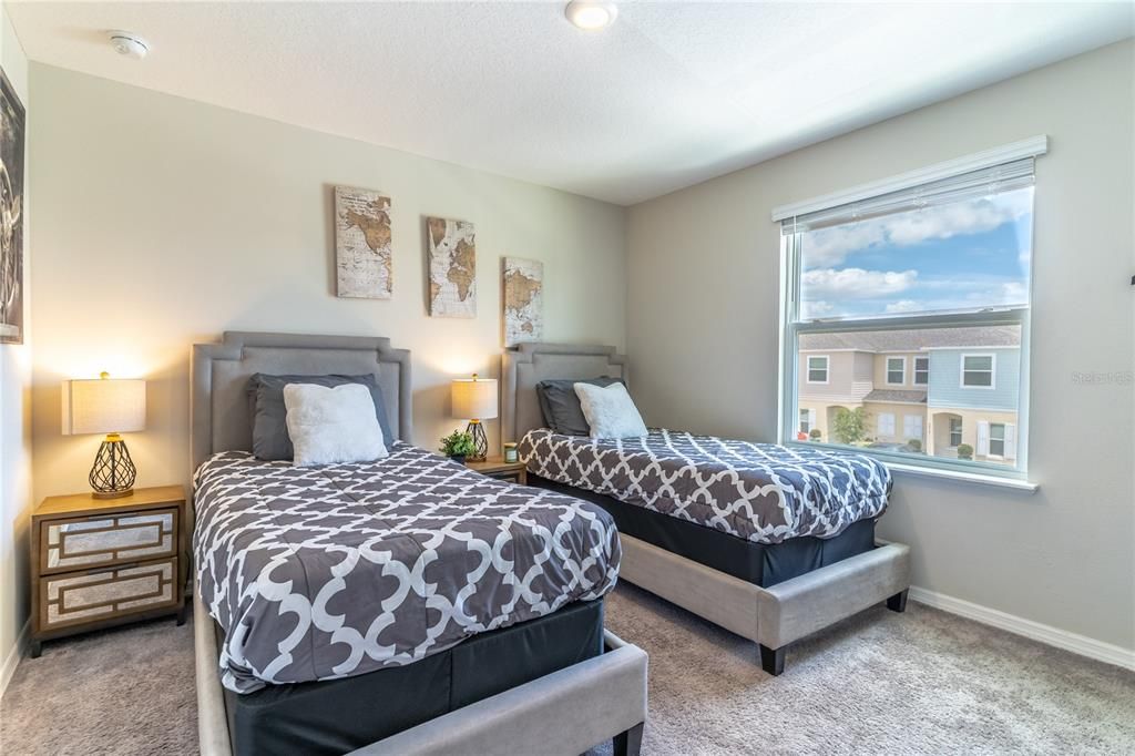 Bedroom two features large window and spacious closet