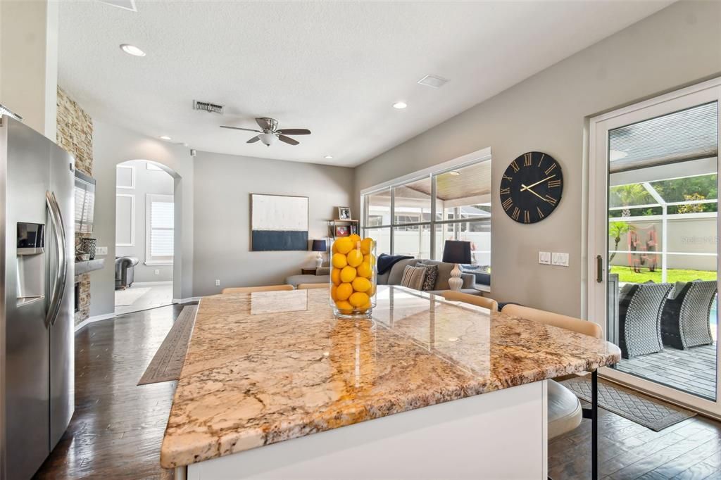 Looking across the kitchen to the family room, with the NEW sliding glass door that leads to the backyard just to the right.