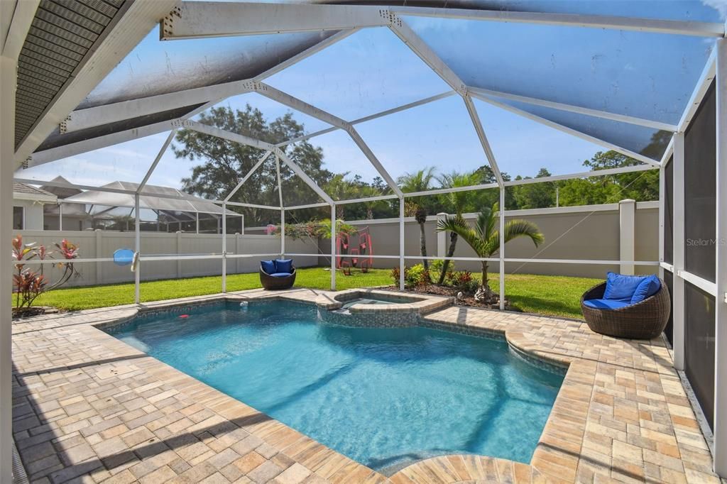 Private backyard with plenty of green space in addition to the pool!