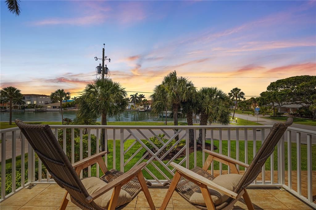 The upstairs porch offers a perfect place to view the stunning Gulf sunsets.