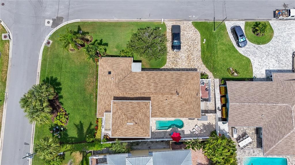 Aerial view of the property with luch landscaping.