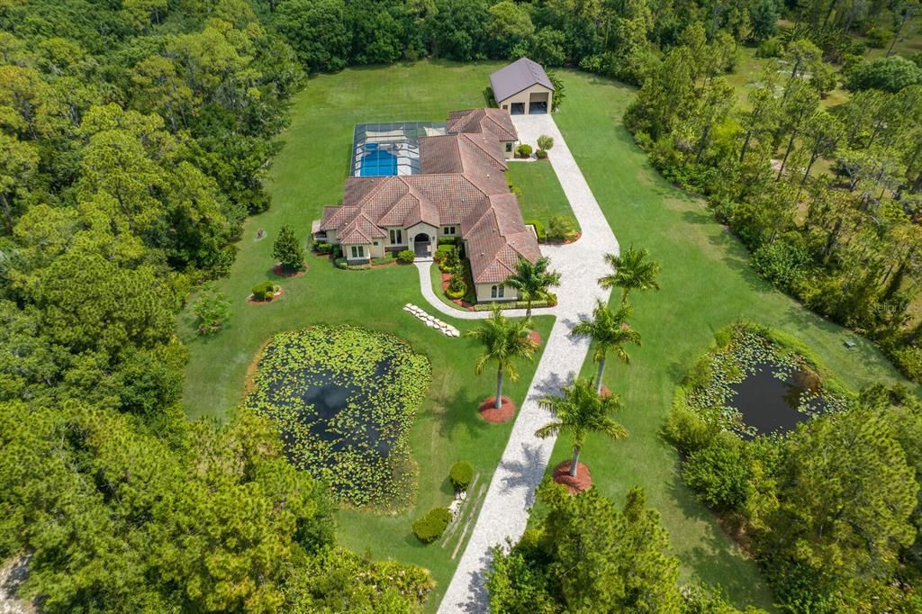 Set on 8.36 acres of lush foliage and private preserve