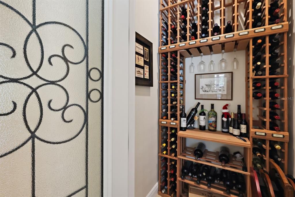 Wine room off the foyer and dining area for entertaining ease