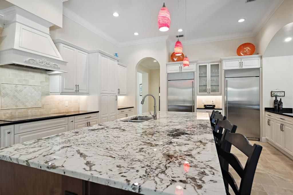 Impressive and lovely all quartz countertops in the kitchen with striking veining.