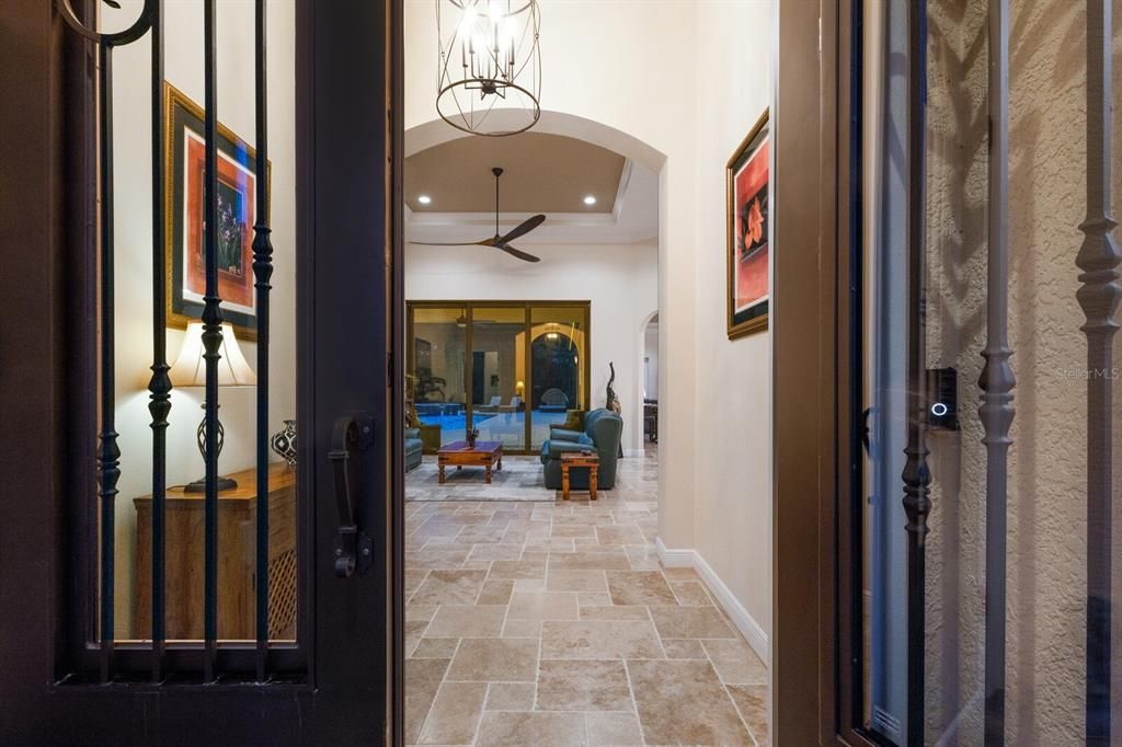 Grand entrance with beautiful Travertine flooring throughout the main floor