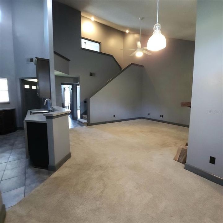 Kitchen view from dining area.  Storage room to left currently used as pantry and contains stackable Washer/Dryer.