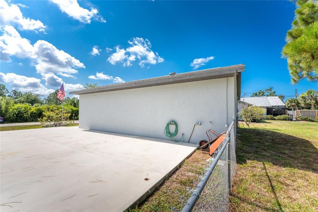 Large concrete pad beside the detached garage -perfect for parking the RV or the boat!