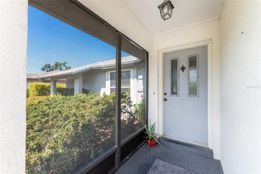 Screened area leading to front door!