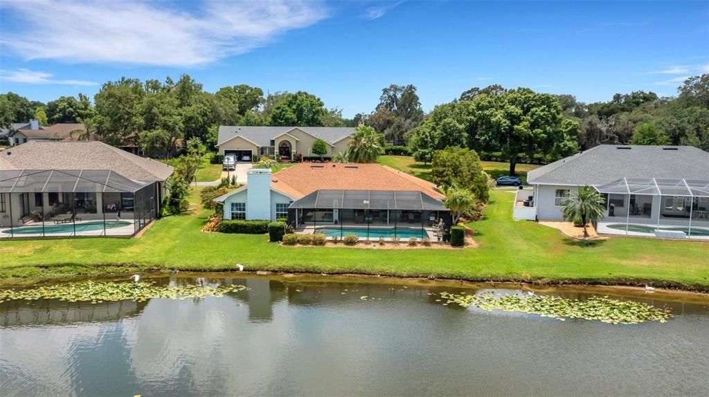 Picture yourself fishing from the banks of this pristine home