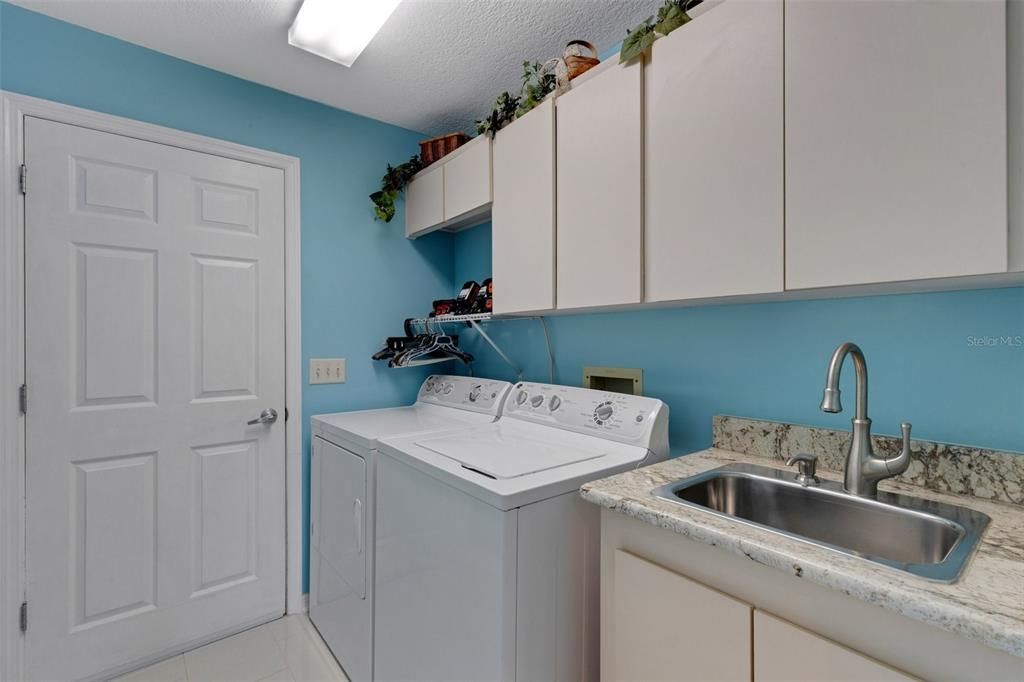 The in door Laundry and entrance to a great 2 car garage, the washer and dryer convey with the sale of this home.