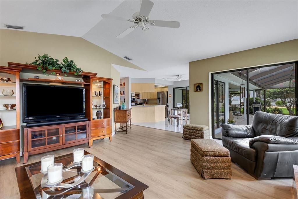 View from the family room into the kitchen and out on to the pool/patio lanai area