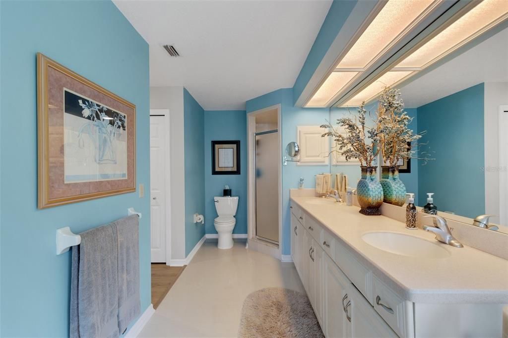 The En-suite Owners bathroom has dual vanities, large walk in shower ...plenty of cabinet & counter top area, linen closet and a great jetted tub