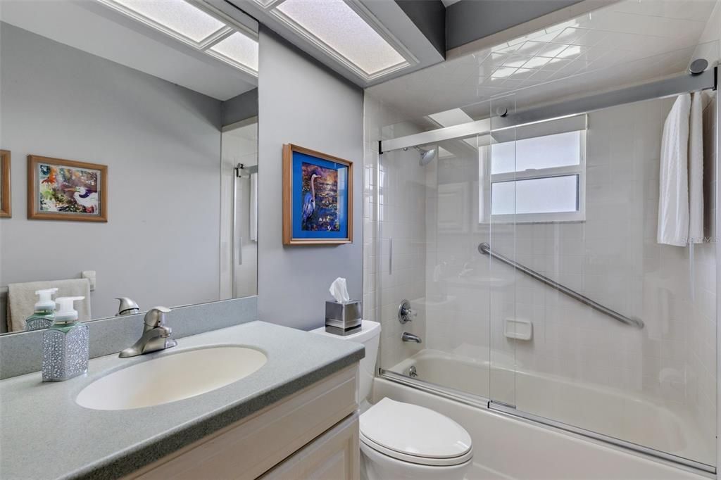 Between Bedrooms 1 & 2 sits this beautifully updated bathroom.