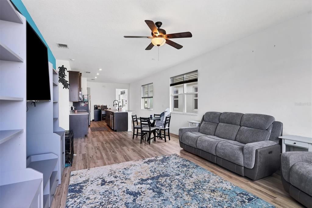 Open Floor Plan Family Room with View to Dining Space and Kitchen