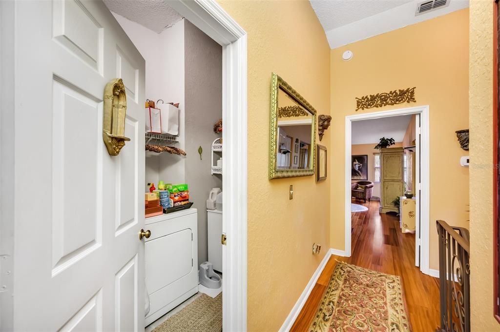 Hallway access to other bedroom and laundry room/storage