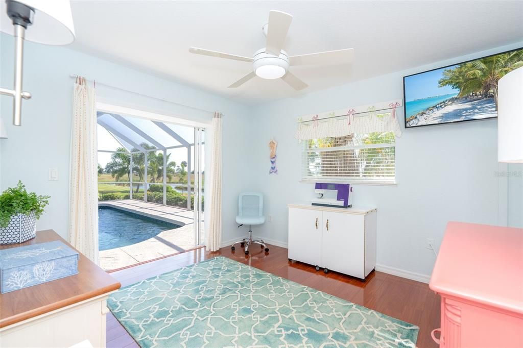 Guest bedroom 2 with slider to pool and lanai