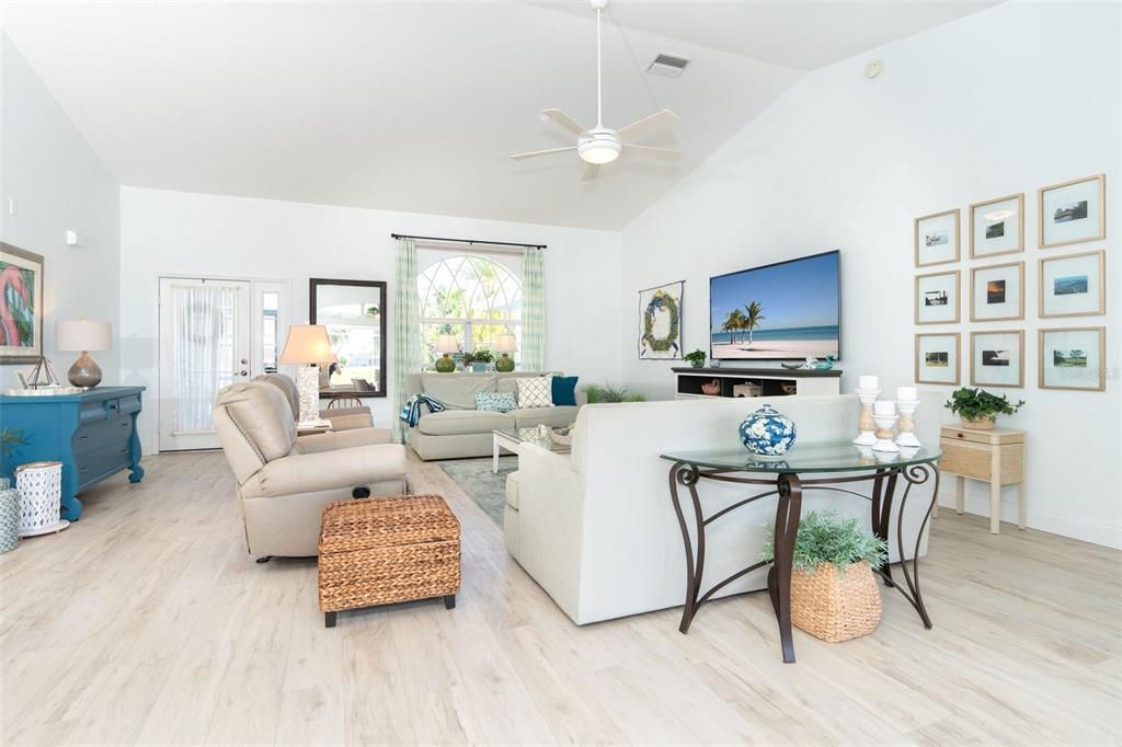 View of Livingroom from the lanai.  Such a great open concept of Florida living