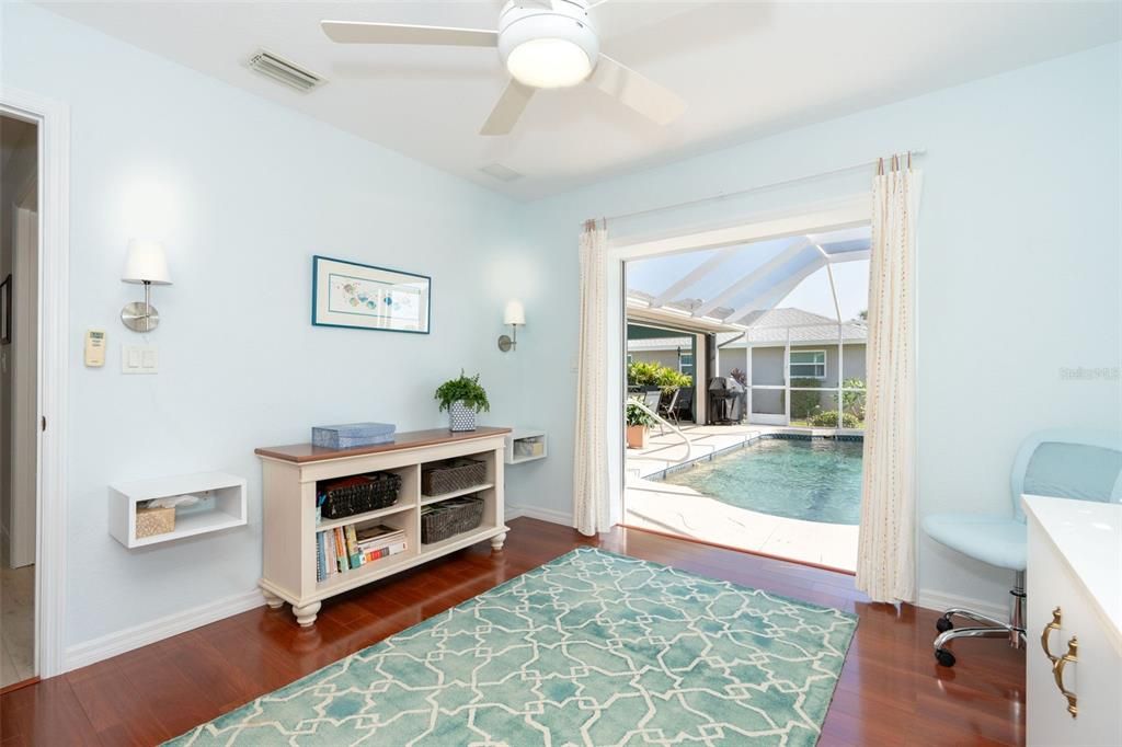 Guest bedroom 2 with slider to pool and lanai