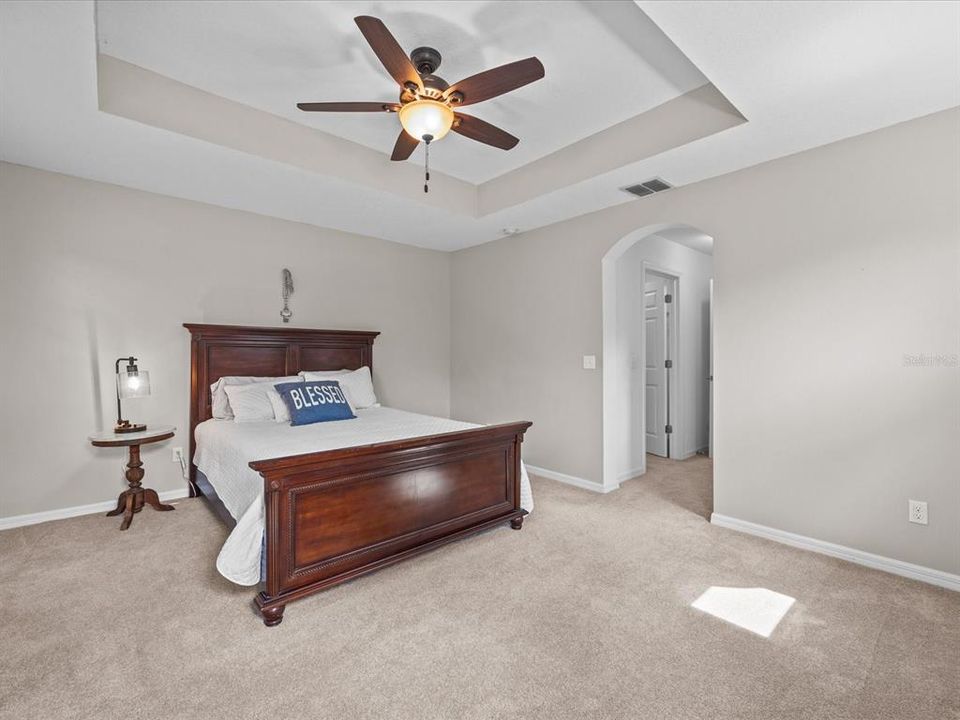 Light and bright master suite with tray ceiling, large walk-in closet and ensuite bathroom