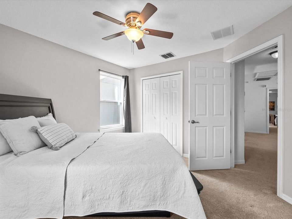 bedroom 3 has a light fixture with built-in fan and is beside bedroom 2