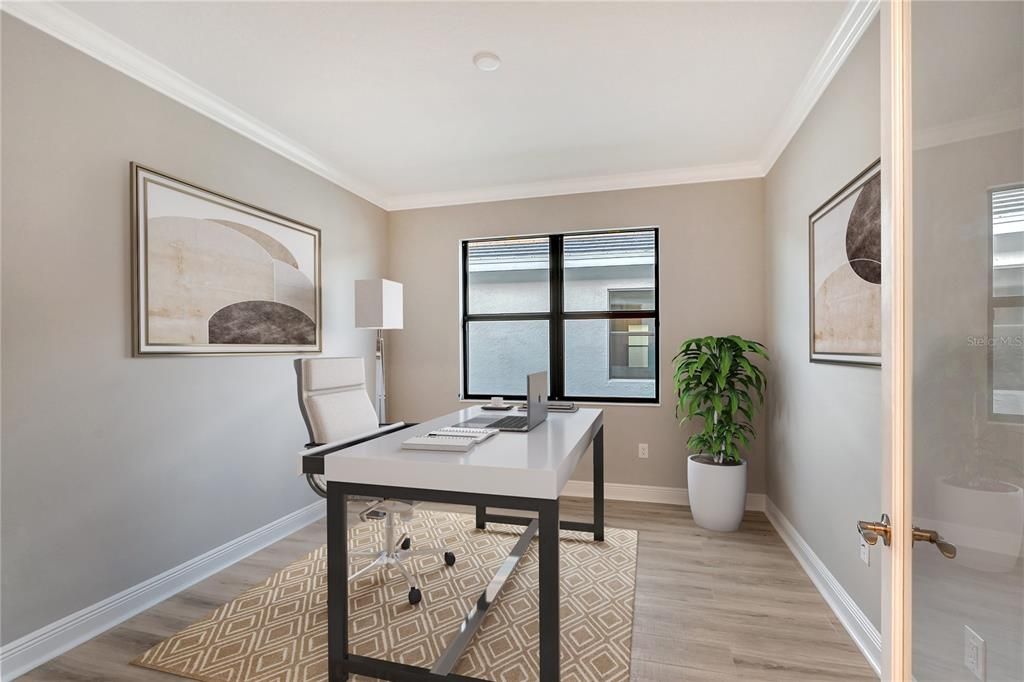 The den/bonus room featuring glass double doors, making this a perfect spot for a home office.