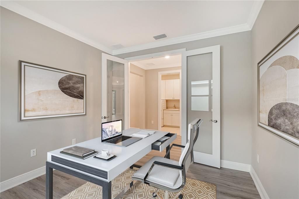 The den/bonus room featuring glass double doors, making this a perfect spot for a home office.