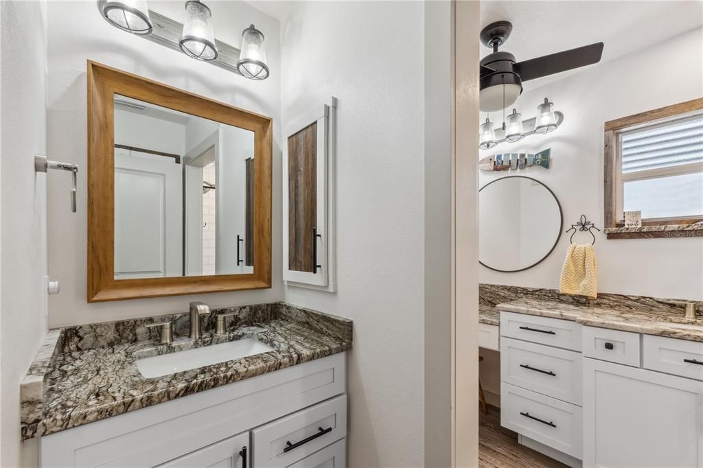 GRANITE AND DUAL SINKS WITH BENCH SHOWER TOO!