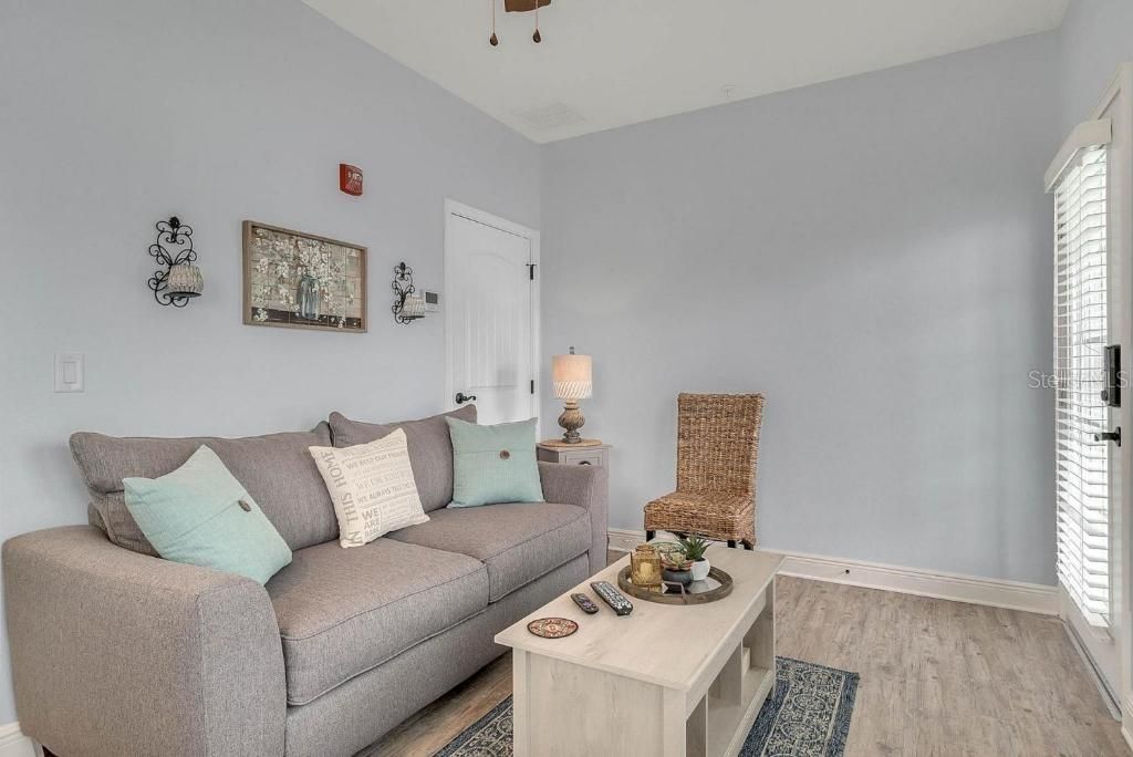 Living area with sleeper sofa and a workstation coffee table.