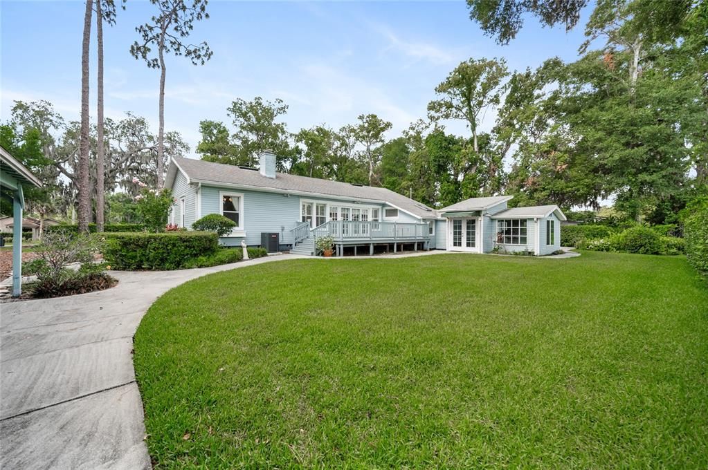 Lush green lawn and room for gardening.