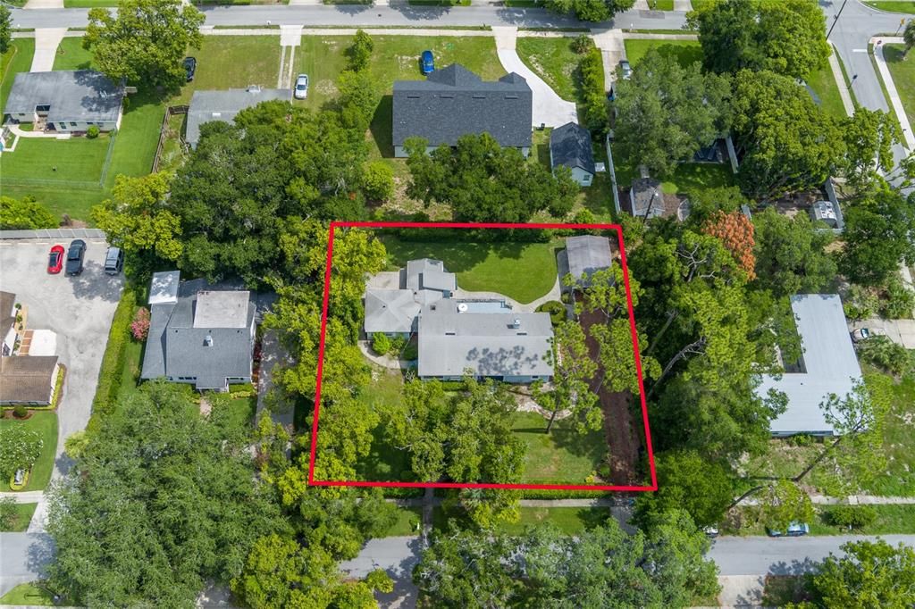 The property is fenced on three sides and has rod iron gates and a natural hedge across the front of the property. .37 Acres lot