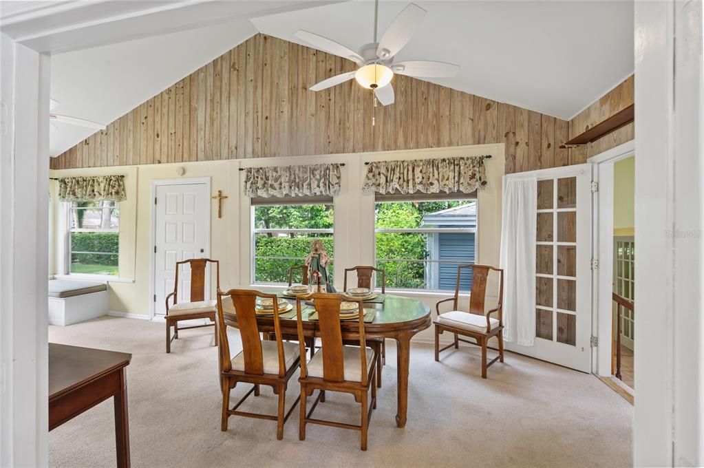 Formal Dining room with high volume ceilings and lots of windows for natural lighting.