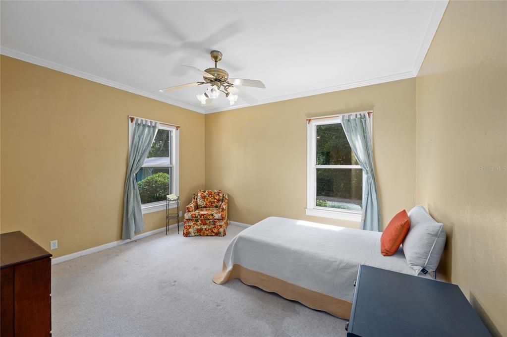 This is a split floor plan 2nd bedroom has natural lighting and a ceiling fan plus a...