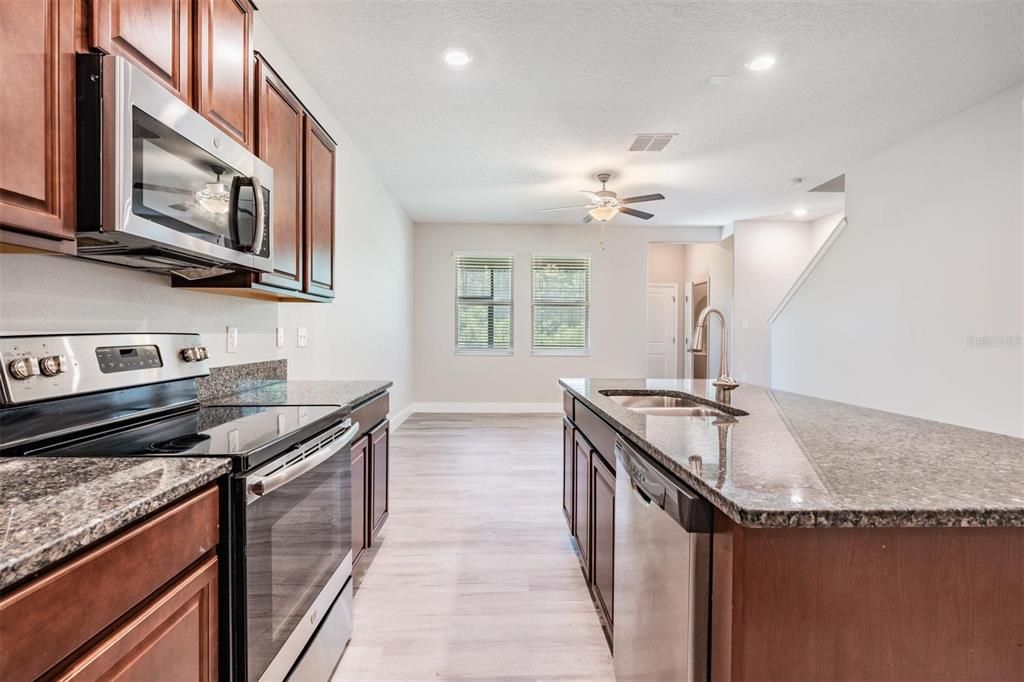 Kitchen & view of closet/storage space