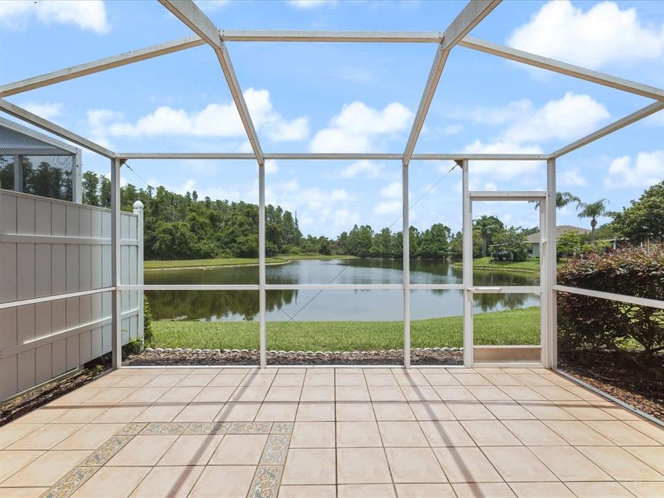 Lanai overlooking large pond backing up to preserve